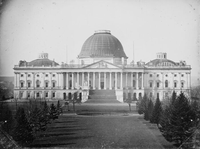 Historic black and white photo of a grand capital building showcasing what the world’s capitals looked like before modern times.