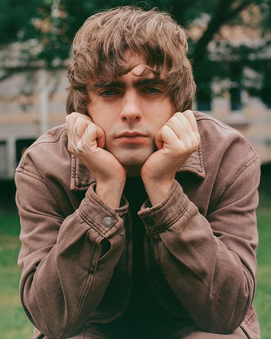 Lennon Gallagher posing outdoors with hands on face, representing nepo babies defining Hollywood’s new generation style.