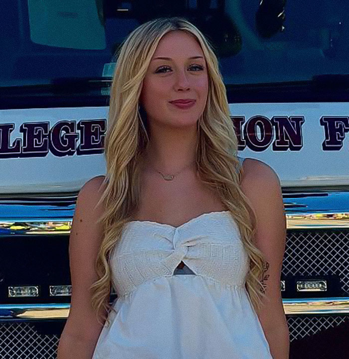 Student with long blonde hair and white top stands smiling in front of a vehicle, linked to Olive Garden hoax story. Student with long blonde hair and white top stands smiling in front of a vehicle, linked to Olive Garden hoax story.