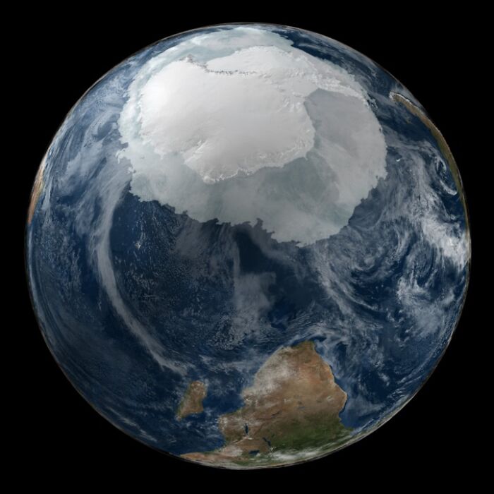 View of Earth from space showing Antarctica covered in ice, illustrating the beauty and mystery of space.