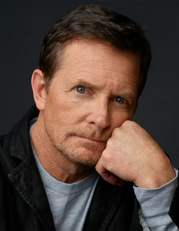 Close-up portrait of a man posing thoughtfully, illustrating famous men who are much shorter than fans imagined.