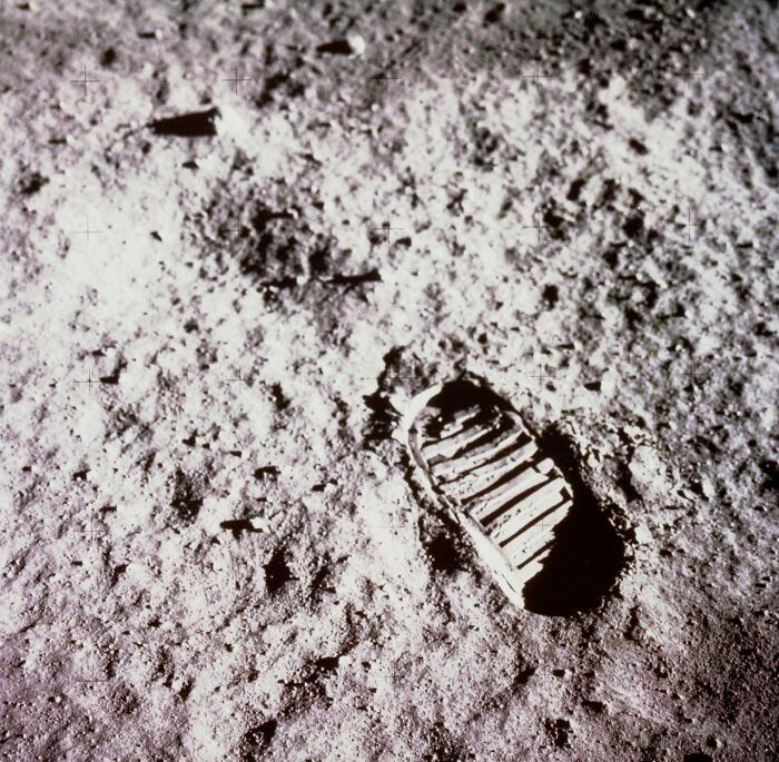 Astronaut boot print on the lunar surface showcasing the mystery and beauty of space exploration in astronomy photos.