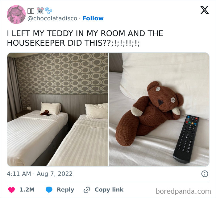 Housekeeper arranges teddy bear lounging with a remote on a neatly made hotel bed showing faith in humanity restored.
