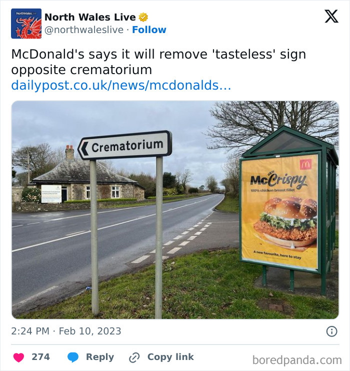Road sign pointing to crematorium beside a McDonald's crispy chicken sandwich ad, creating accidental comedy humor.