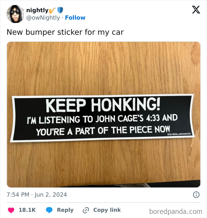 Funny bumper sticker on wood, saying keep honking and referencing John Cage’s 4:33, shared by drivers spotting humor on the road.