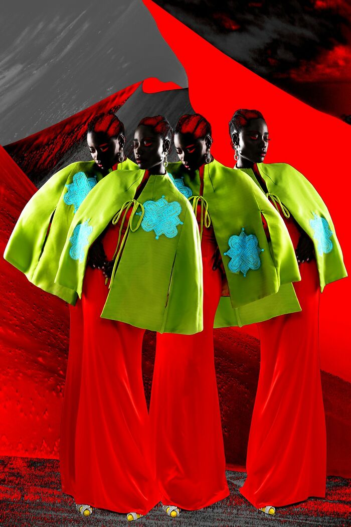 Four models wearing bright green and red high-fashion outfits in an artistic photo from the 2025 photographer award-winning contest.
