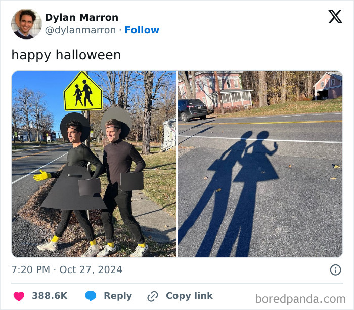 Two people wearing creative Halloween costumes inspired by crosswalk signs, casting shadows on the street.