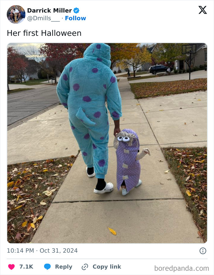 Toddler and parent in creative kids Halloween costume ideas walking on a sidewalk during fall evening.