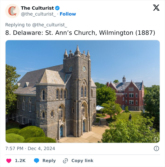 Stone Gothic-style church with tall tower and arched windows, surrounded by greenery in Wilmington, Delaware.