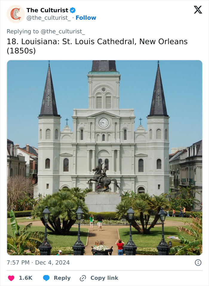 St. Louis Cathedral in New Orleans, a striking church with historic architecture and twin spires in a lush garden setting.