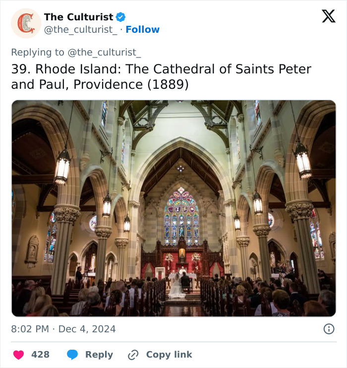 Interior view of a spectacular historic church with stained glass windows and high vaulted ceilings in Rhode Island.