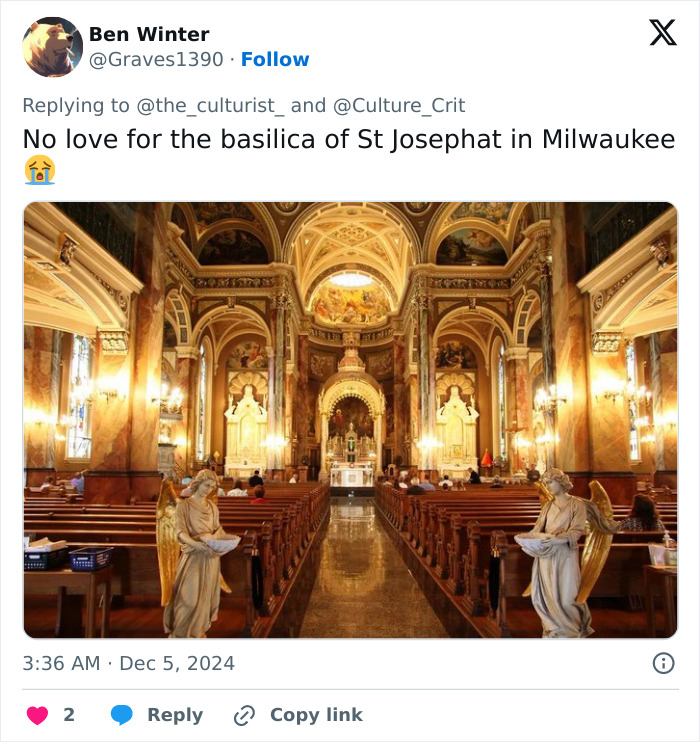 Interior view of a striking church with ornate architecture, statues, and detailed ceiling paintings in the US.