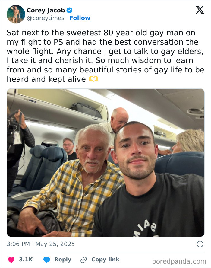 Two men smiling on a flight showing kindness and wisdom, highlighting positive stories of men are good in the world.