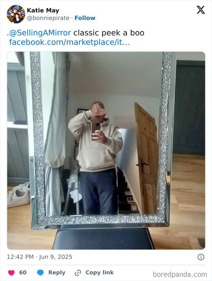 Man covering his face while taking a mirror selfie in a decorative frame, showing a funny reflection selling a mirror.