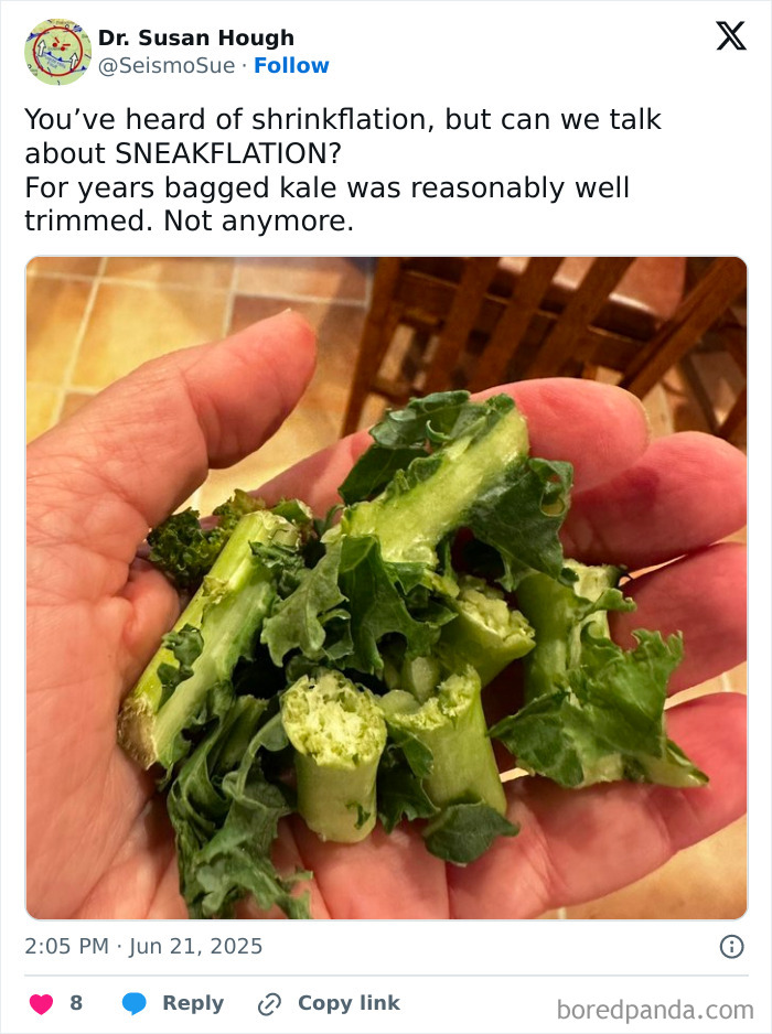 Hand holding poorly trimmed kale stems illustrating examples of sneakflation affecting product quality and size.