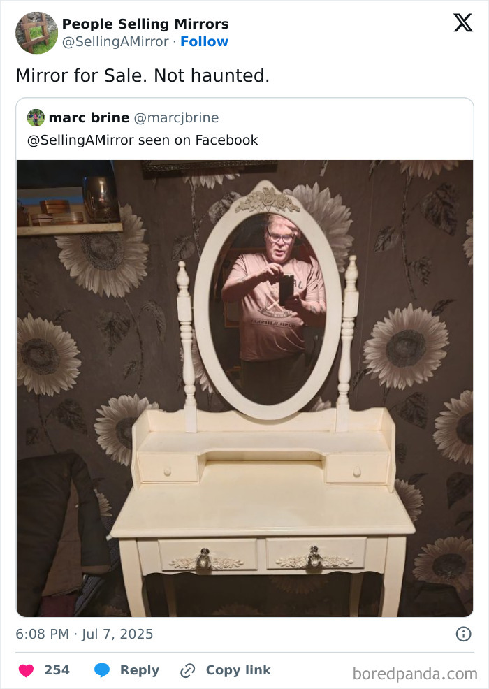 Man taking selfie in a mirror while selling a vintage vanity table highlighting mirror reflection humor.