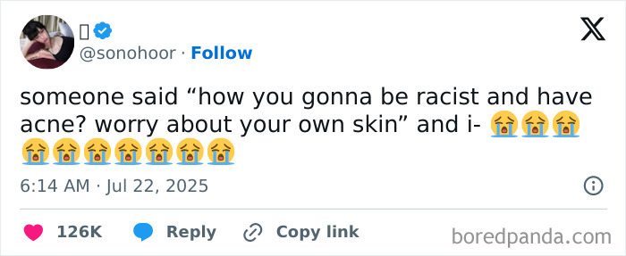 Screenshot of a hilarious tweet about racism and acne with crying emojis, part of funny tweets people couldn’t help but share.