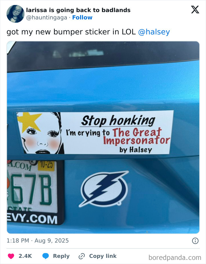 Blue car with a funny bumper sticker that says Stop honking, I'm crying to The Great Impersonator by Halsey.