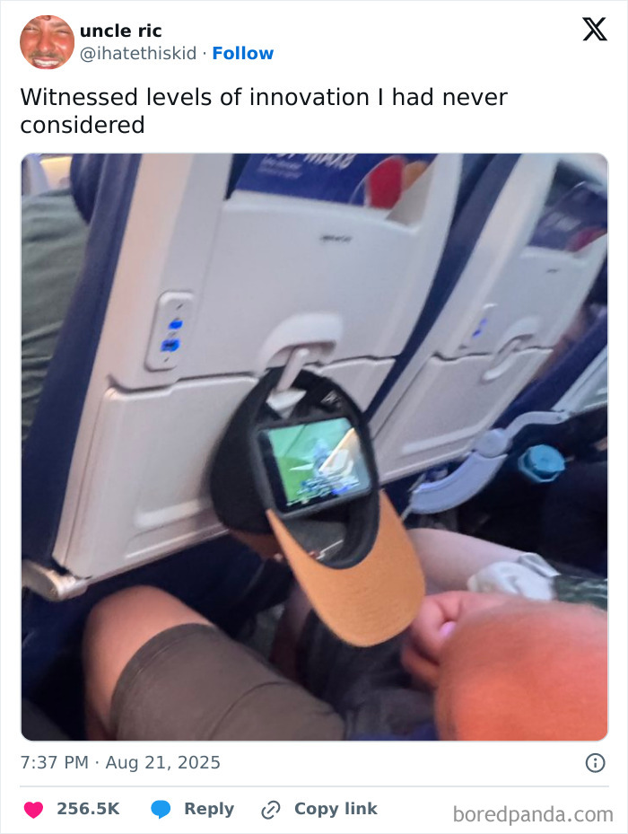Tweet showing creative use of a baseball cap to hold a phone, illustrating hilarious tweets shared by people on social media.