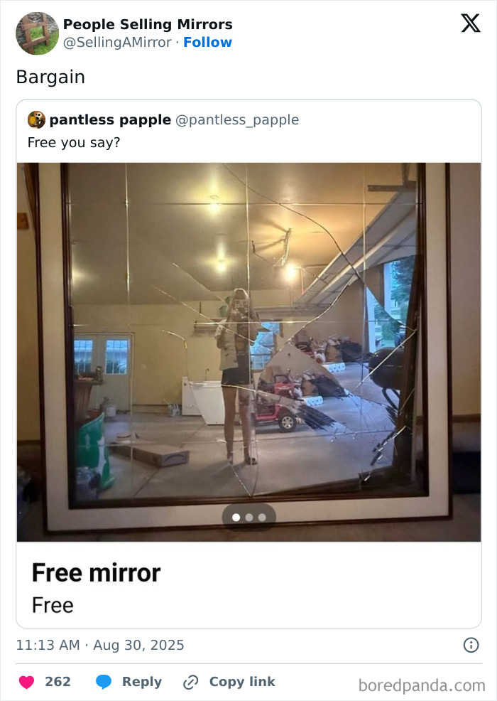 Broken mirror with c*****d glass reflecting a person taking a photo in a cluttered room, highlighting funny mirror selling attempts.