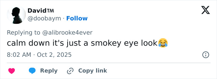 Tweet reply discussing a smokey eye look, related to the topic of plastic surgeon controversy in LA.