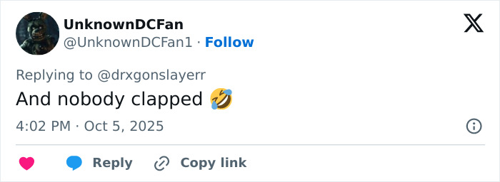 Tweet from user UnknownDCFan replying with a laughing emoji about Taylor Swift's cringe Graham Norton appearance being picked apart by fans.