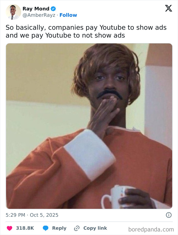 Man in a brown wig and mustache holding a cup, featured in a funny tweet about Netflix gotta add a comment section.