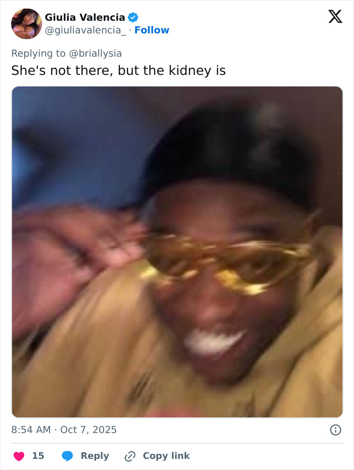 Blurry image of a person smiling and adjusting golden sunglasses, related to Selena Gomez kidney wedding controversy.