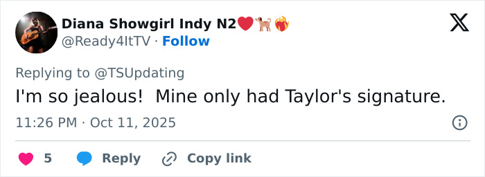 Tweet expressing jealousy over Taylor Swift fans reacting to Travis Kelce autographed albums, sparking tradwife controversy.