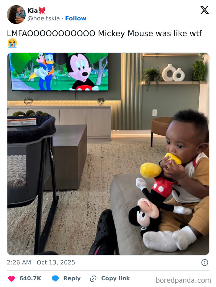 Child holding a Mickey Mouse toy while watching a humorous cartoon on TV, related to Netflix funny tweets.