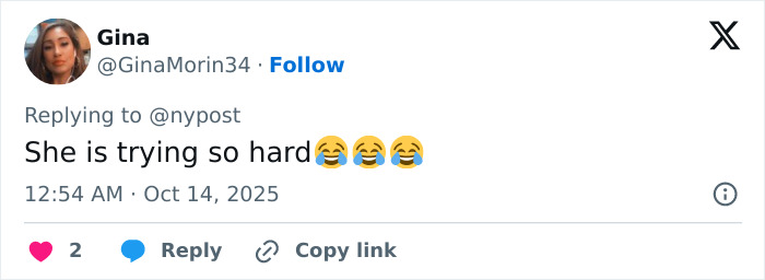 Screenshot of a Twitter reply with laughing emojis discussing Meghan Markle and Paris Fashion Week controversy.