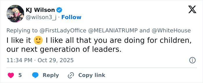 Screenshot of a social media reply praising Melania Trump's White House Halloween display for children and future leaders.