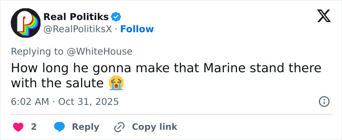 Tweet from Real Politik questioning the Marine's salute duration in Melania Trump's White House Halloween display.