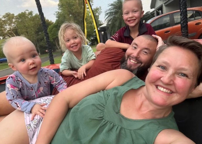 Family rushing out of rental house reacting with concern after making a disturbing discovery showing emotional urgency outdoors