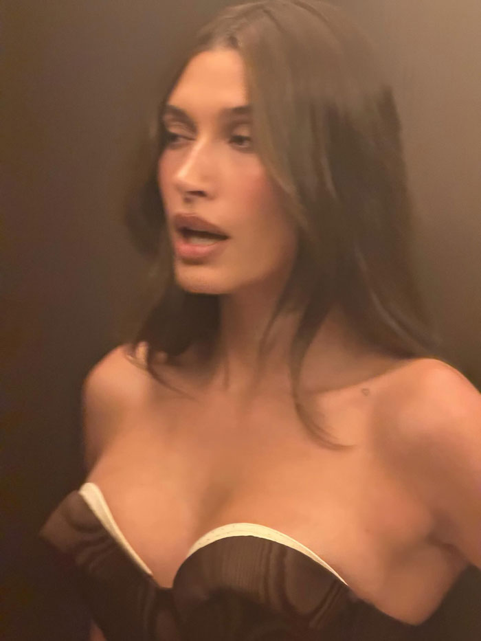 Hailey Bieber in a strapless dress at the Academy Museum Gala, avoiding run-in with Selena Gomez, sharing an iconic moment.