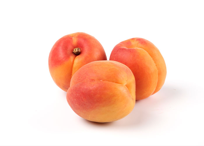 Three ripe peaches with a crease resembling a bottom, illustrating the concept of breathing through your bottom. Three ripe peaches with a crease resembling a bottom, illustrating the concept of breathing through your bottom.