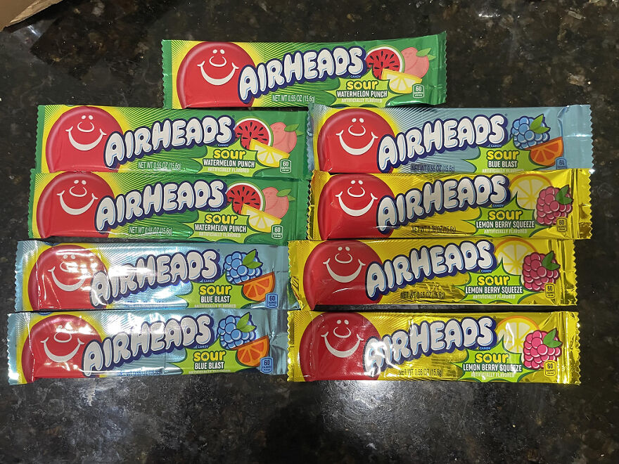 Assortment of Airheads candy in sour flavors displayed on a dark surface for popular Halloween candy ranking 2025.