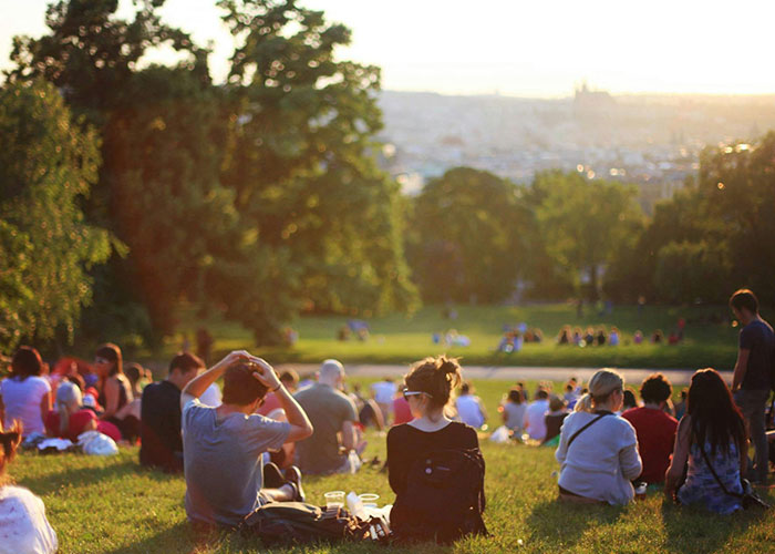People enjoying a sunny day in a park, illustrating life hacks and simple pleasures discovered accidentally.