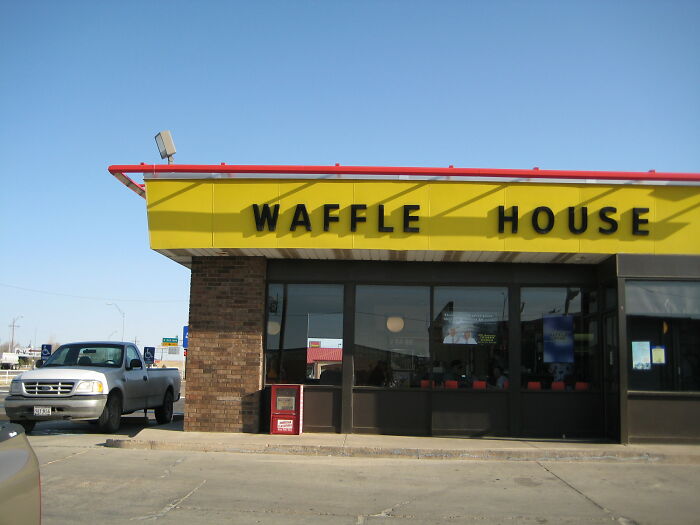 Waffle House exterior with parking lot, illustrating restaurant staff tales about bills and unpaid money situations.