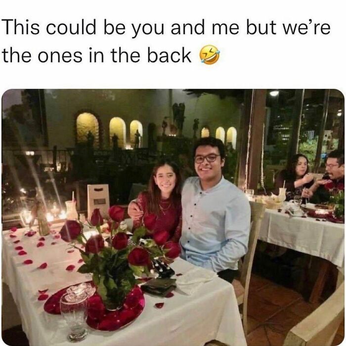 Couple smiling at a romantic dinner with roses, while another couple laughs in the background, relatable relationship meme.