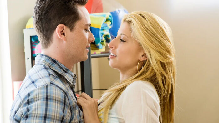 Couple embracing closely in a warm setting, representing scenes from movies based on true stories.