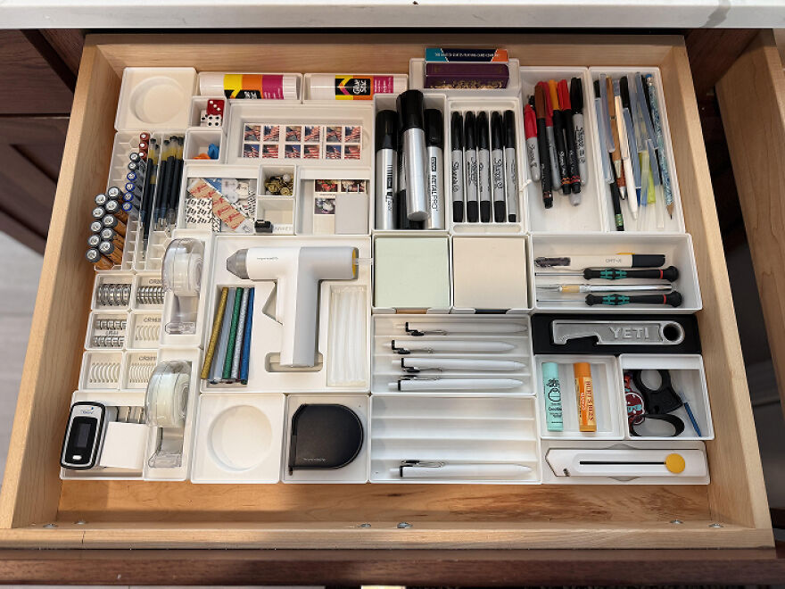 Neatly arranged office supplies in drawer showcasing organization hacks for a clutter-free and efficient home workspace.