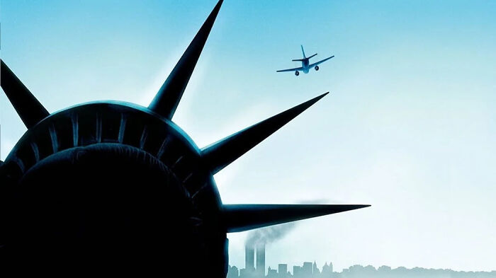 Statue of Liberty crown with airplane flying over city skyline, representing movies based on true stories that feel impossible.