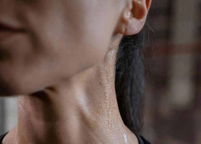 Close-up of a person’s neck with visible skin texture, highlighting potential cosmetic procedure concerns.