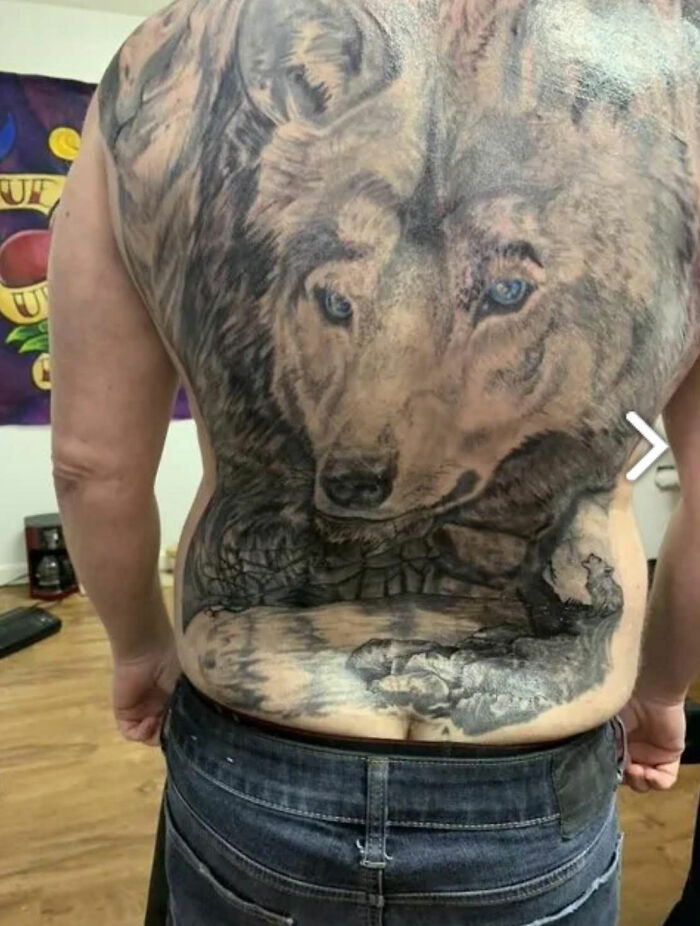 Large detailed wolf tattoo covering entire back of a person showcasing unique tattoos you wouldn’t believe people allowed.