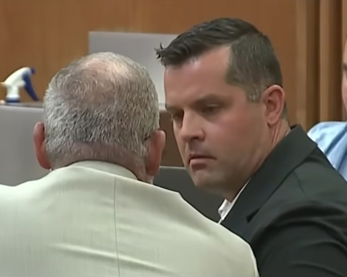 Man in a courtroom listening intently during trial involving a hot car death of a 2-year-old daughter.