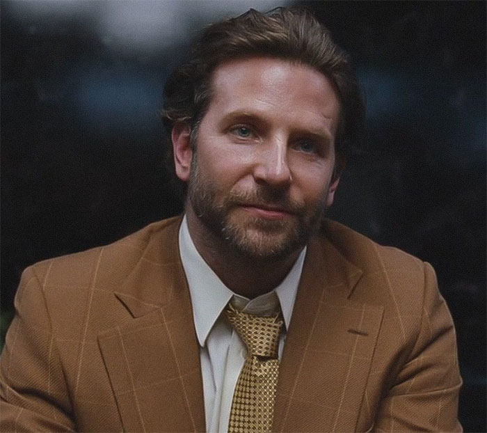 Bradley Cooper in a brown suit and patterned tie, with plastic surgeons commenting on his seemingly new look. Bradley Cooper in a brown suit and patterned tie, with plastic surgeons commenting on his seemingly new look.