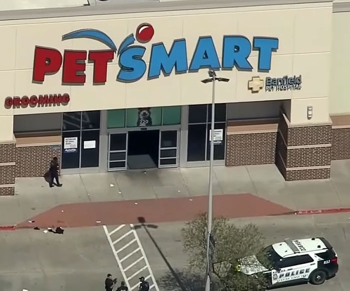 Police presence outside pet store after woman loses life following argument over not saying thank you.