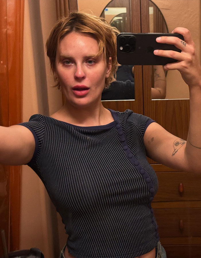 Bruce Willis' daughter taking a selfie in a mirror wearing a striped black top, addressing Perez Hilton’s cruel comments. Bruce Willis' daughter taking a selfie in a mirror wearing a striped black top, addressing Perez Hilton’s cruel comments.