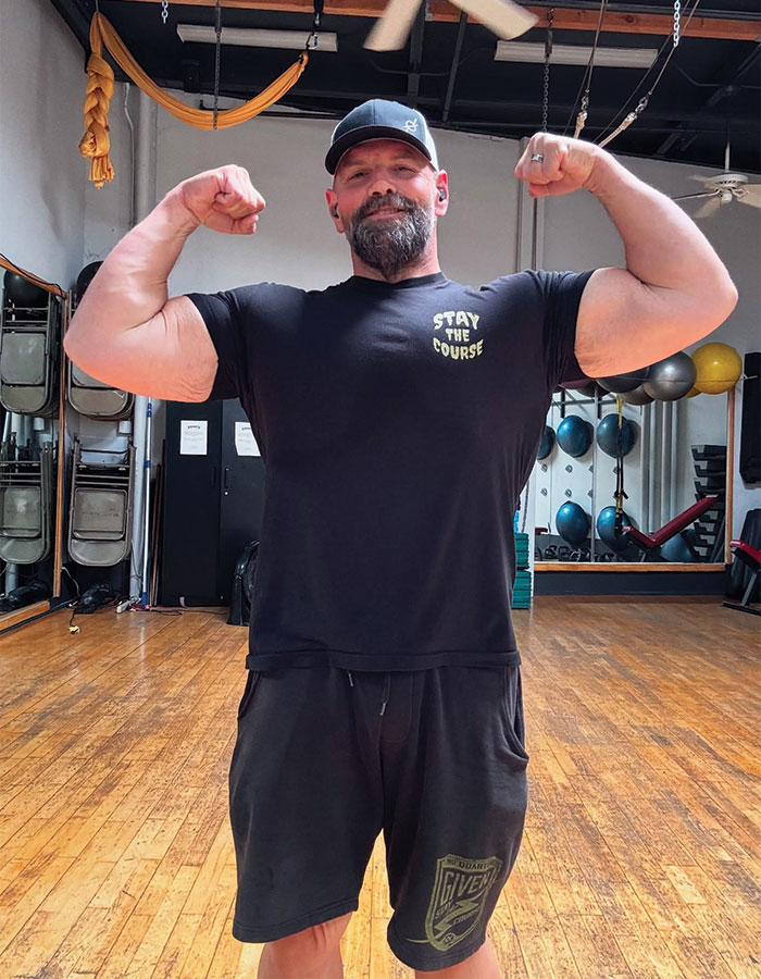 Actor from My Name Is Earl flexing muscles in a gym, showcasing stunning new look after major weight loss journey.